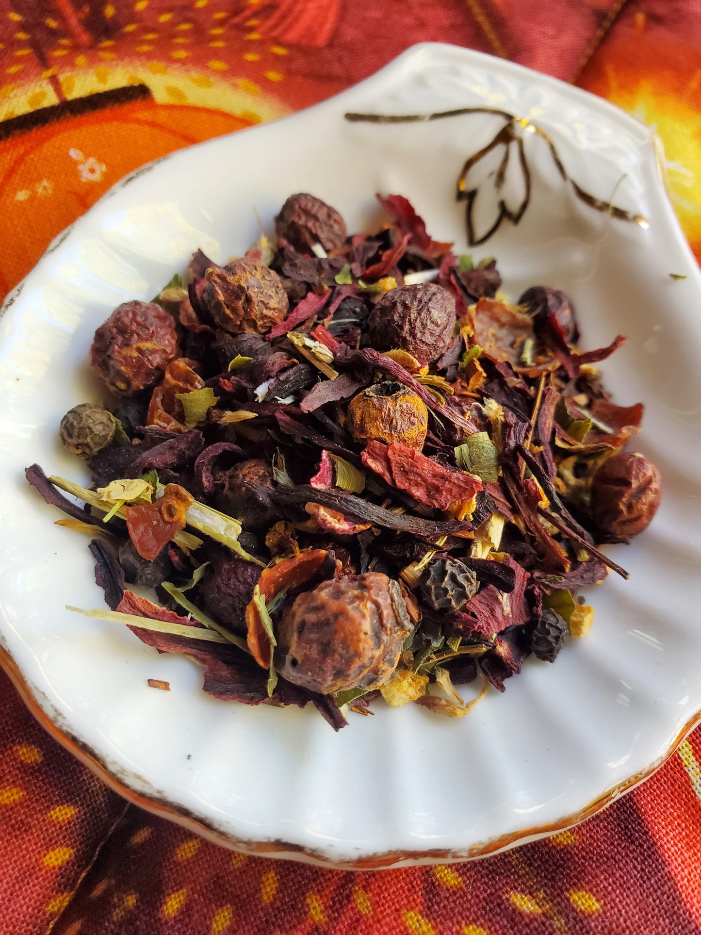 Assorted dried herbs and spices mixed with roselle hibiscus to create an lightly spiced herbal tea.